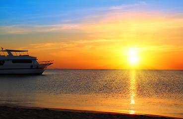 Image showing ship at anchor and sunrise over sea