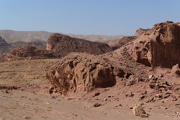 Image showing Scenic weathered red rocks  in stone desert 