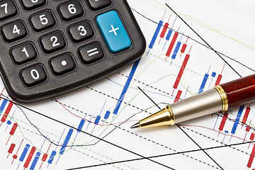 Image showing  business graph and a magnifier 