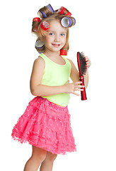 Image showing Little girl play hairdresser