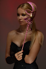 Image showing Lady at masquerade with pink mask