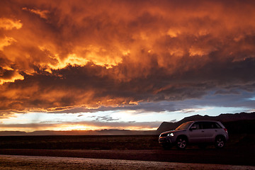 Image showing Orange sky and 4x4