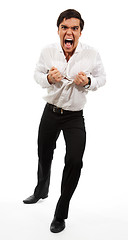 Image showing Frustrated business man tearing apart his shirt