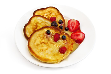 Image showing Three pancakes with berries