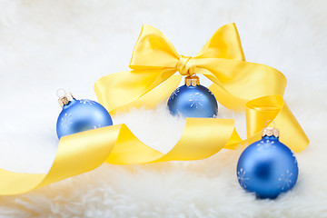 Image showing Christmas balls with yellow ribbon bow