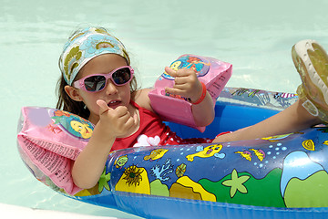 Image showing Child in pool relaxing