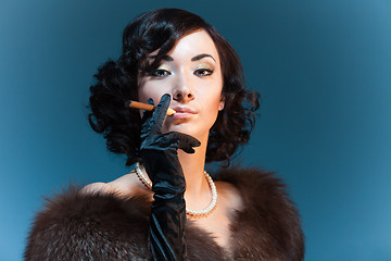 Image showing Retro style woman with cigar