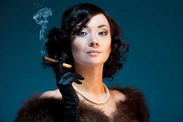 Image showing Retro woman smoking cigar