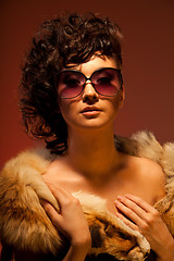 Image showing Gorgeous woman in fur and glasses