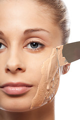 Image showing put on makeup foundation with spatula