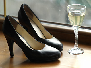 Image showing Female Shoes and Glass of Wine