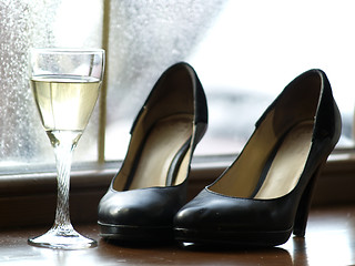 Image showing Female Shoes and Glass of Wine