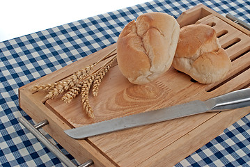 Image showing Slices of bread on top of wooden board