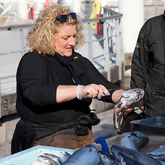 Image showing MARSEILLE, FRANCE, MARCH 6: a fish saleswoman on the open-air market of the Vieux-port, on Sunday, March 6th, 2011, in Marseille, France.