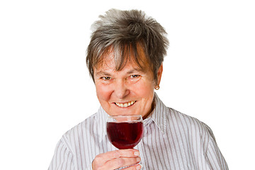 Image showing Female senior with glass wine