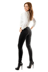 Image showing Playful beautiful girl in black tight jeans