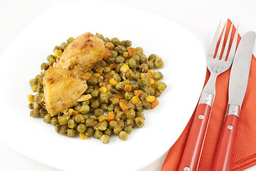 Image showing Chicken meat with green peas, carrots and corns on table