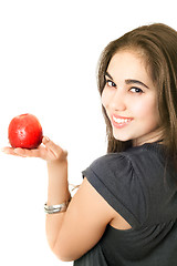 Image showing Joyful girl with an apple