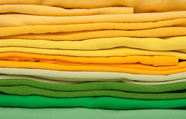 Image showing Folded green and yellow clothes