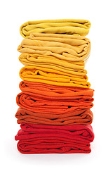 Image showing Pile of red and yellow folded clothes