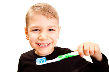 Image showing The boy brushes teeth