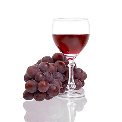 Image showing Red grapes and glass with wine