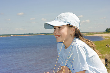 Image showing The girl on river bank