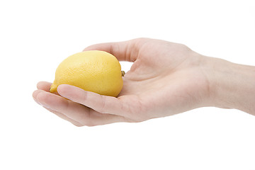 Image showing Yellow lemon in a hand