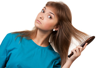 Image showing young beautiful girl is combed