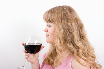 Image showing The young woman with a wine glass