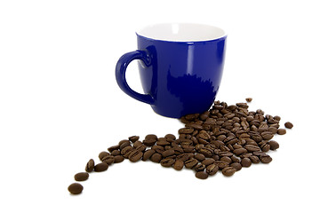 Image showing Dark blue mug and scattered coffee