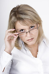 Image showing The strict blonde in glasses