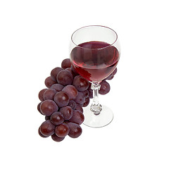 Image showing Red grapes and glass with wine