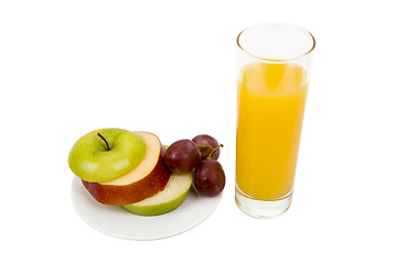 Image showing Plate with an apple and a juice glass