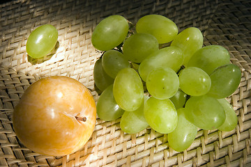 Image showing Yellow plum and grapes