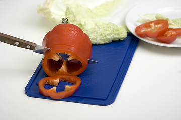 Image showing Red pepper on a chopping board