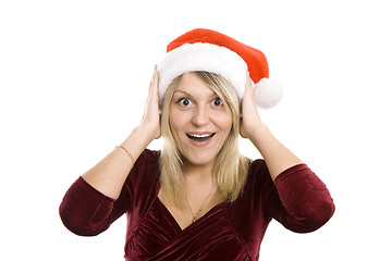 Image showing The admired woman in a red Christmas cap