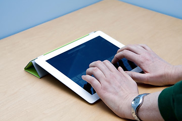 Image showing iPad 2 tablet user hands typing