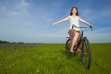 Image showing Girl with a bicycle