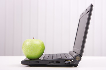 Image showing The laptop and apple