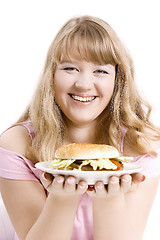 Image showing The young girl with a hamburger