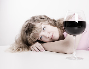 Image showing The young woman with wine glass
