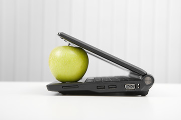 Image showing The laptop and apple