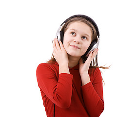 Image showing The child listens to music