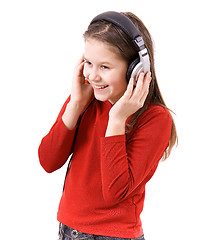 Image showing The child listens to music