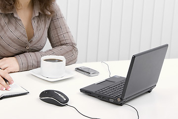 Image showing The young business woman at office