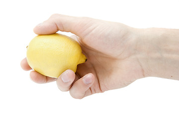 Image showing Yellow lemon in a hand