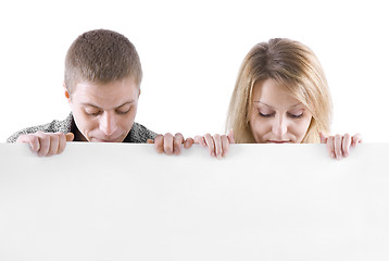 Image showing man and the woman behind the white stand