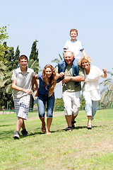 Image showing Happy family playing in the park