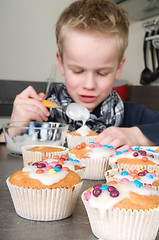 Image showing Decorating the cupcakes